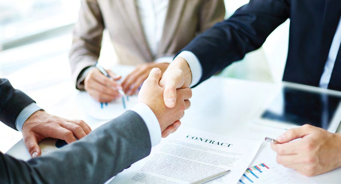 Business handshake over a contract